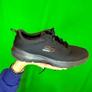 Women’s black mesh uppers 
Skechers tie shoes